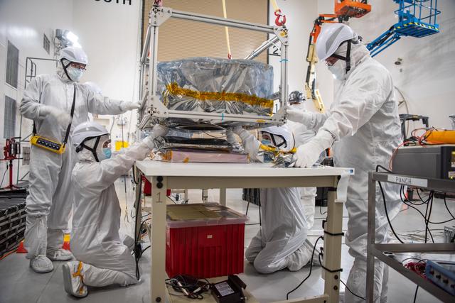NASA image: PUNCH Satellites Lift to Work Stand fo Testing Operations