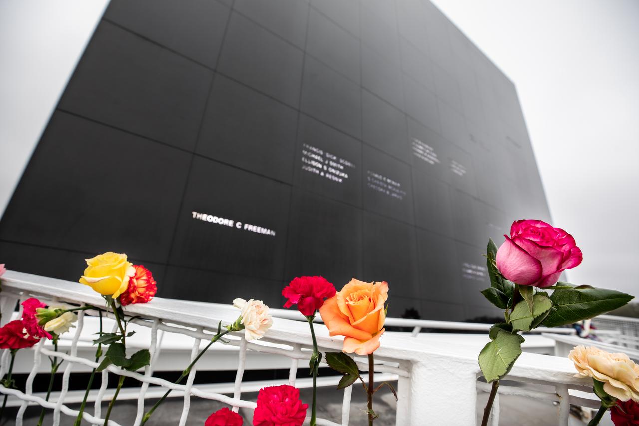 Flowers placed before the Space Mirror Memorial at the Kennedy Space Center Visitor Complex in Florida commemorate NASA’s Day of Remembrance on Thursday, Jan. 23, 2025. The mirror was dedicated in 1991 to honor all astronauts who lost their lives on missions or during training. During the Day of Remembrance, NASA centers across the country honor those astronauts who have fallen in the pursuit of space exploration.