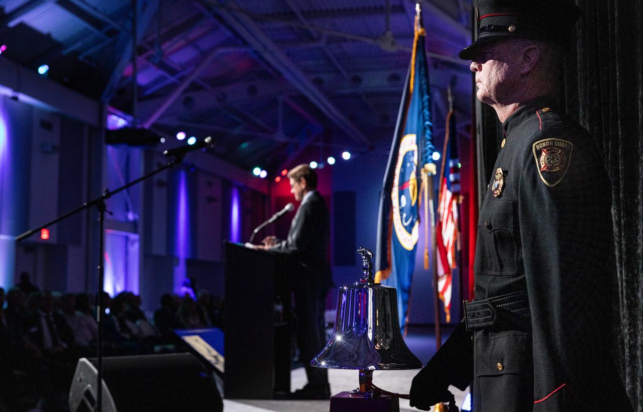 A member of the Brevard County Fire Rescue Honor Guard rings the bell during NASA’s Day of Remembrance ceremony on Thursday, Jan. 23, 2025, inside the Center for Space Education at the Kennedy Space Center Visitor Complex in Florida. The annual event honors the crews of Apollo 1 and space shuttles Challenger and Columbia, as well as other astronauts who lost their lives in the pursuit of spaceflight. This year’s ceremony was hosted by the Astronauts Memorial Foundation, which was founded after the shuttle Challenger accident in 1986 to honor the sacrifices of fallen astronauts each year.