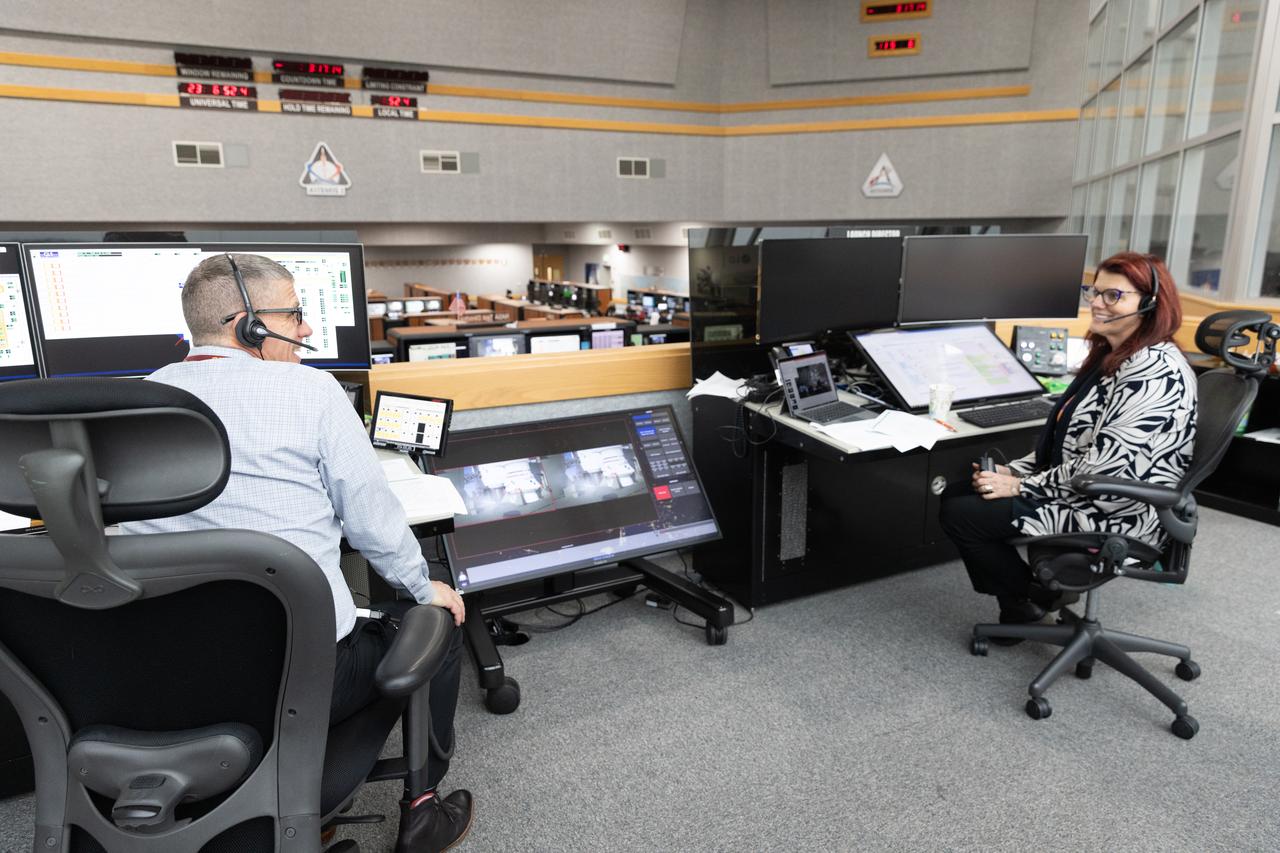 Jeremy Graeber, at left, assistant Artemis launch director, and Charlie Blackwell-Thompson, at left, NASA Artemis launch director, participate in an Artemis II launch countdown simulation inside Firing Room 1 in the Launch Control Center at NASA’s Kennedy on Thursday, Jan. 23, 2025. The simulations go through launch day scenarios to help launch team members test software and make adjustments if needed during countdown operations. For Artemis II, four astronauts will venture around the Moon, the first crewed mission on NASA’s path to establishing a long-term presence for science and exploration through Artemis.