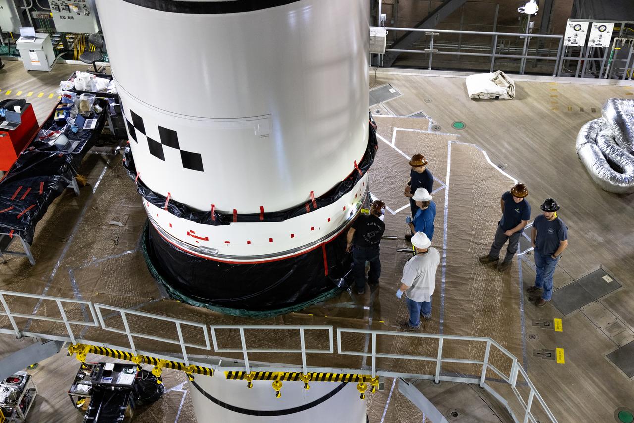 Technicians with NASA’s Exploration Ground Systems complete the integration of the left forward segment to the center forward segment on mobile launcher 1 inside the Vehicle Assembly Building at the agency’s Kennedy Space Center in Florida on Friday, Feb. 7, 2025. The twin solid boosters, five segments on each side, will help support the remaining rocket components and the Orion spacecraft during final assembly of the Artemis II Moon rocket and provide more than 75 percent of the total SLS thrust during liftoff from NASA Kennedy’s Launch Pad 39B. 