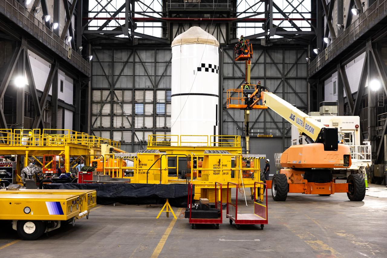 Technicians transport the right forward segment for NASA’s SLS (Space Launch System) Moon rocket boosters from the Rotation Processing and Surge Facility to NASA’s Vehicle Assembly Building in Florida on Monday, Feb. 15, 2025. The right forward segment will be transferred into High Bay 3 where it will be attached to the center forward segment on mobile launcher 1. The twin solid boosters, five segments on each side, will help support the remaining rocket components and the Orion spacecraft during final assembly of the Artemis II Moon rocket and provide more than 75 percent of the total SLS thrust during liftoff from NASA Kennedy’s Launch Pad 39B.
