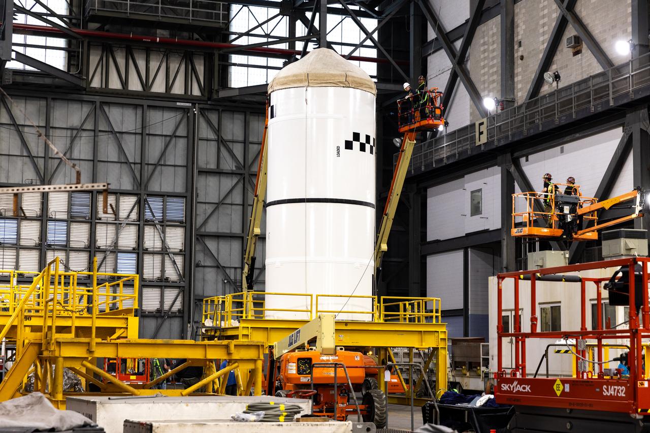 Technicians transport the right forward segment for NASA’s SLS (Space Launch System) Moon rocket boosters from the Rotation Processing and Surge Facility to NASA’s Vehicle Assembly Building in Florida on Monday, Feb. 15, 2025. The right forward segment will be transferred into High Bay 3 where it will be attached to the center forward segment on mobile launcher 1. The twin solid boosters, five segments on each side, will help support the remaining rocket components and the Orion spacecraft during final assembly of the Artemis II Moon rocket and provide more than 75 percent of the total SLS thrust during liftoff from NASA Kennedy’s Launch Pad 39B.
