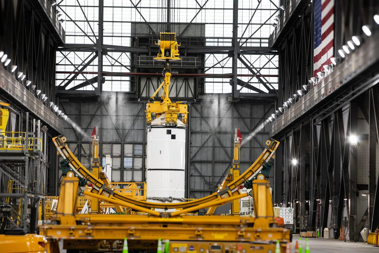 Technicians with Exploration Ground Systems prepare to transfer and lift the right forward segment for NASA’s SLS (Space Launch System) Moon rocket boosters into High Bay 3 inside NASA’s Vehicle Assembly Building in Florida on Wednesday, Feb. 12, 2025. The right forward segment will be attached to the center forward segment on mobile launcher 1. The twin solid boosters, five segments on each side, will help support the remaining rocket components and the Orion spacecraft during final assembly of the Artemis II Moon rocket and provide more than 75 percent of the total SLS thrust during liftoff from NASA Kennedy’s Launch Pad 39B. 