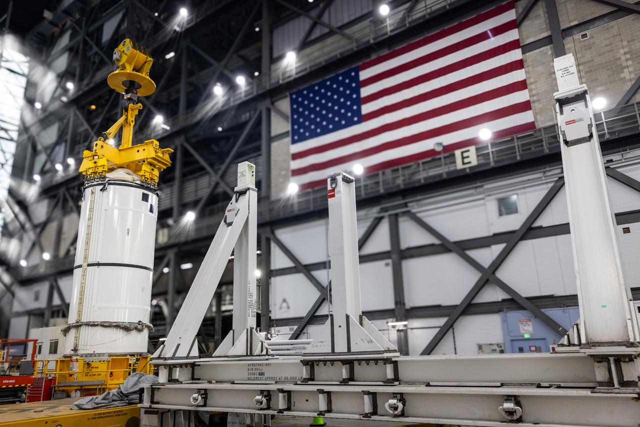 Technicians with Exploration Ground Systems prepare to transfer and lift the right forward segment for NASA’s SLS (Space Launch System) Moon rocket boosters into High Bay 3 inside NASA’s Vehicle Assembly Building in Florida on Wednesday, Feb. 12, 2025. The right forward segment will be attached to the center forward segment on mobile launcher 1. The twin solid boosters, five segments on each side, will help support the remaining rocket components and the Orion spacecraft during final assembly of the Artemis II Moon rocket and provide more than 75 percent of the total SLS thrust during liftoff from NASA Kennedy’s Launch Pad 39B. 