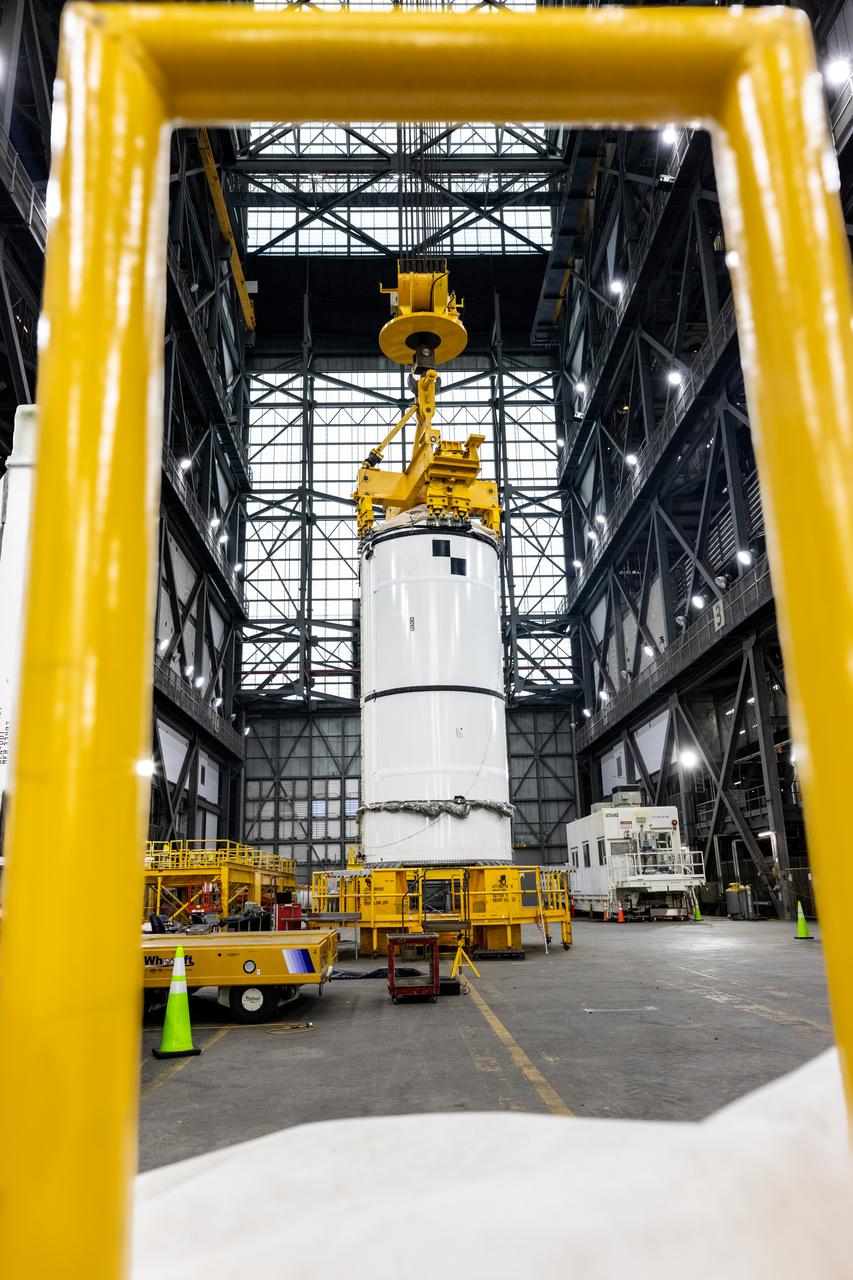 Technicians with Exploration Ground Systems prepare to transfer and lift the right forward segment for NASA’s SLS (Space Launch System) Moon rocket boosters into High Bay 3 inside NASA’s Vehicle Assembly Building in Florida on Wednesday, Feb. 12, 2025. The right forward segment will be attached to the center forward segment on mobile launcher 1. The twin solid boosters, five segments on each side, will help support the remaining rocket components and the Orion spacecraft during final assembly of the Artemis II Moon rocket and provide more than 75 percent of the total SLS thrust during liftoff from NASA Kennedy’s Launch Pad 39B. 