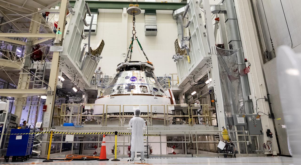 Technicians with NASA and Lockheed Martin operate a 30-ton crane to move NASA’s Artemis II Orion spacecraft out of the Final Assembly and System Testing cell inside the Neil A. Operations and Checkout Building at NASA’s Kennedy Space Center in Florida on Saturday, Feb. 22, 2025. The move prepares for the upcoming installation of four solar array wings and spacecraft adapter jettison fairings for the agency’s first crewed flight test under the Artemis campaign. 