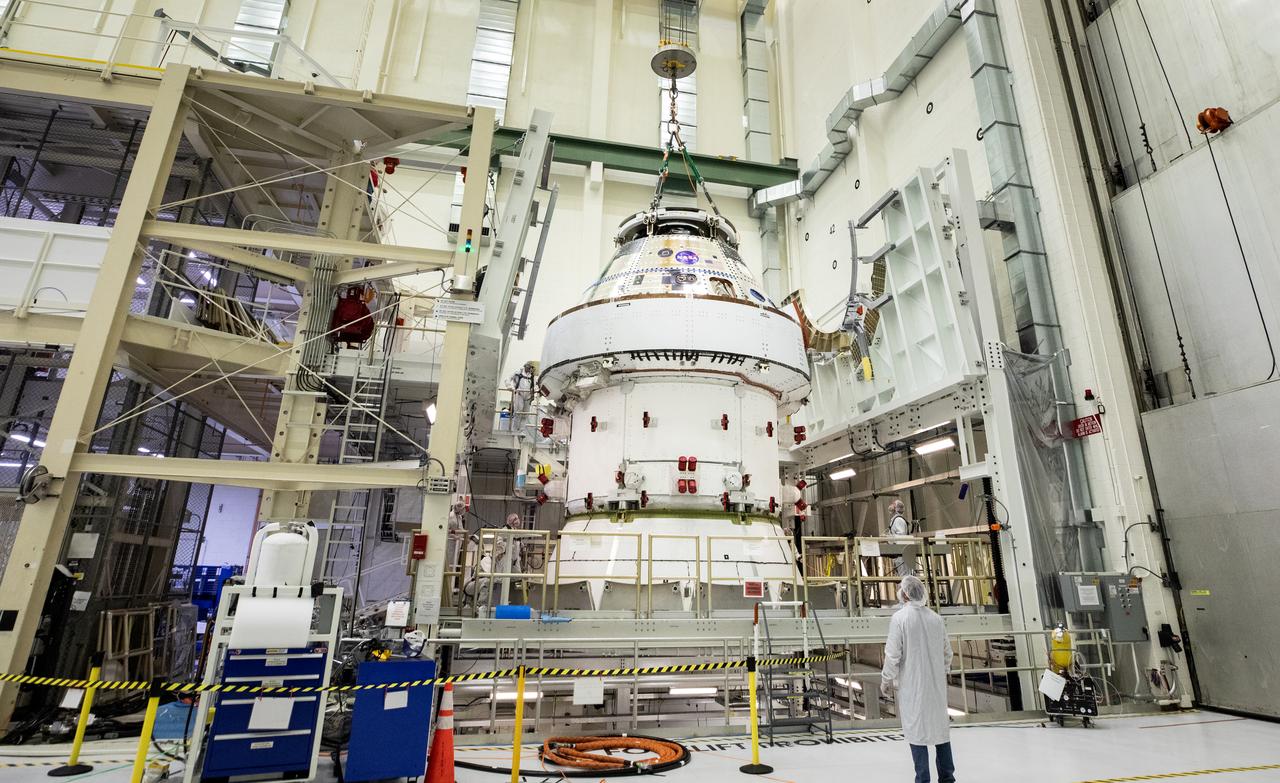 Technicians with NASA and Lockheed Martin operate a 30-ton crane to move NASA’s Artemis II Orion spacecraft out of the Final Assembly and System Testing cell inside the Neil A. Operations and Checkout Building at NASA’s Kennedy Space Center in Florida on Saturday, Feb. 22, 2025. The move prepares for the upcoming installation of four solar array wings and spacecraft adapter jettison fairings for the agency’s first crewed flight test under the Artemis campaign. 