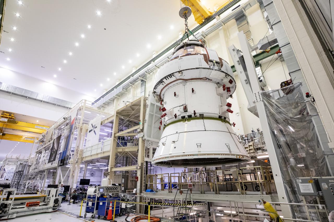 Technicians with NASA and Lockheed Martin operate a 30-ton crane to move NASA’s Artemis II Orion spacecraft out of the Final Assembly and System Testing cell inside the Neil A. Operations and Checkout Building at NASA’s Kennedy Space Center in Florida on Saturday, Feb. 22, 2025. The move prepares for the upcoming installation of four solar array wings and spacecraft adapter jettison fairings for the agency’s first crewed flight test under the Artemis campaign.