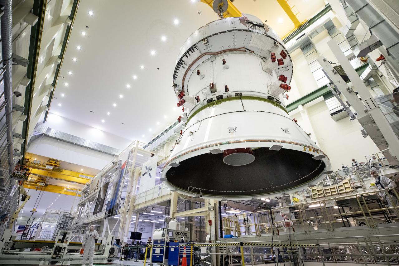 Technicians with NASA and Lockheed Martin operate a 30-ton crane to move NASA’s Artemis II Orion spacecraft out of the Final Assembly and System Testing cell inside the Neil A. Operations and Checkout Building at NASA’s Kennedy Space Center in Florida on Saturday, Feb. 22, 2025. The move prepares for the upcoming installation of four solar array wings and spacecraft adapter jettison fairings for the agency’s first crewed flight test under the Artemis campaign.
