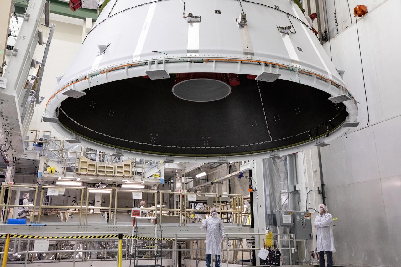Technicians with NASA and Lockheed Martin operate a 30-ton crane to move NASA’s Artemis II Orion spacecraft out of the Final Assembly and System Testing cell inside the Neil A. Operations and Checkout Building at NASA’s Kennedy Space Center in Florida on Saturday, Feb. 22, 2025. The move prepares for the upcoming installation of four solar array wings and spacecraft adapter jettison fairings for the agency’s first crewed flight test under the Artemis campaign. 