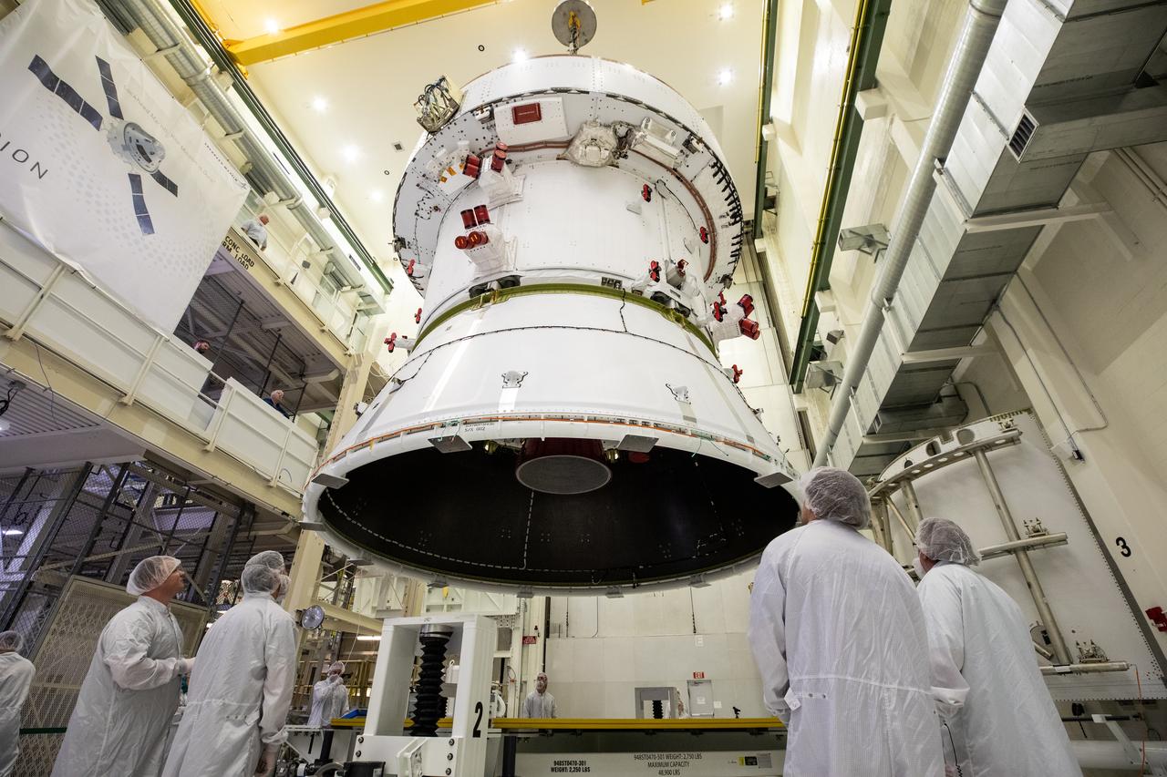 Technicians with NASA and Lockheed Martin operate a 30-ton crane to move NASA’s Artemis II Orion spacecraft out of the Final Assembly and System Testing cell inside the Neil A. Operations and Checkout Building at NASA’s Kennedy Space Center in Florida on Saturday, Feb. 22, 2025. The move prepares for the upcoming installation of four solar array wings and spacecraft adapter jettison fairings for the agency’s first crewed flight test under the Artemis campaign.