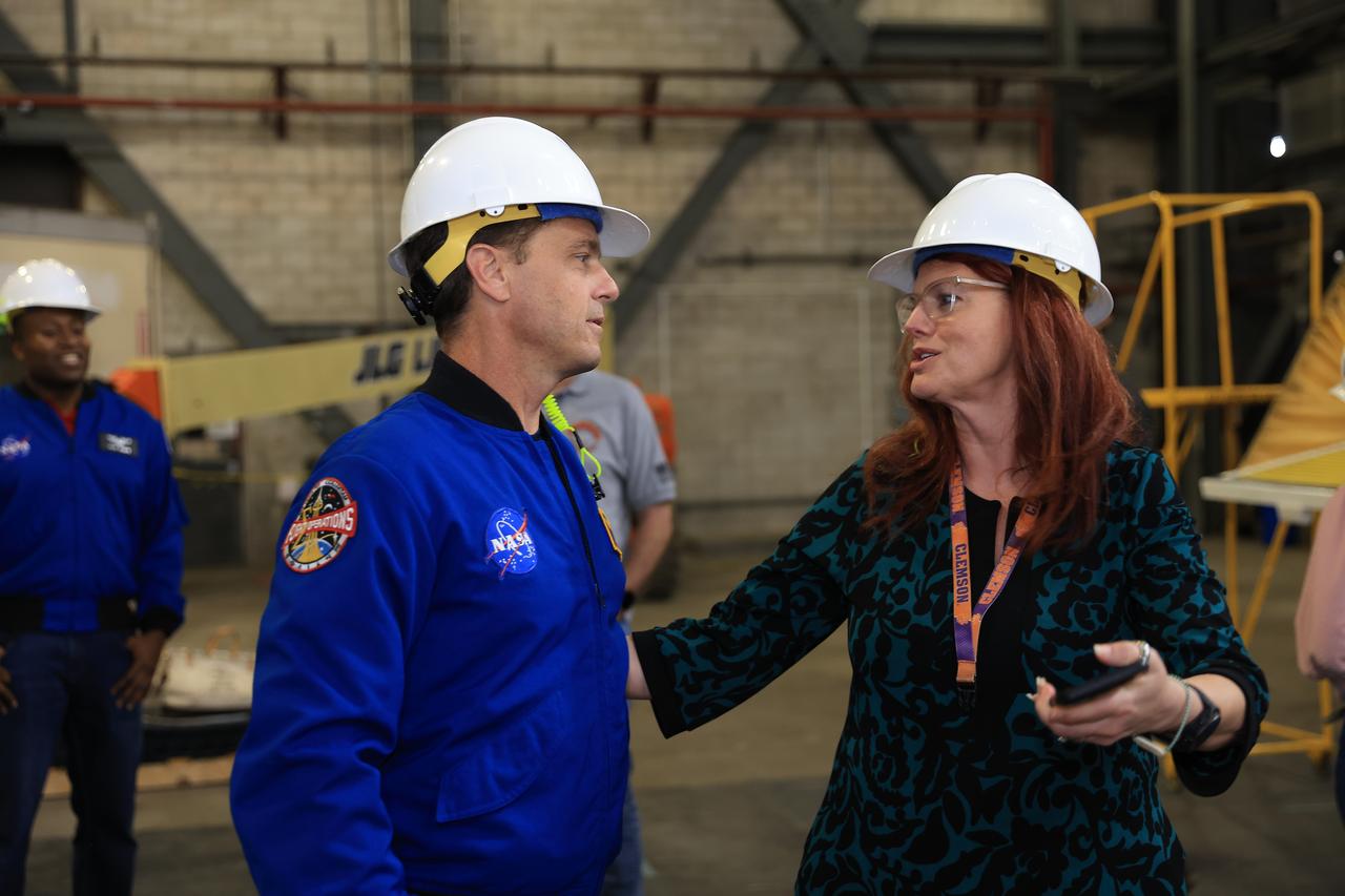 From left, Artemis II NASA astronaut Reid Wiseman, commander, and Charlie Blackwell-Thompson, launch director for NASA’s Exploration Ground Systems Program at Kennedy Space Center in Florida tour Artemis II operations inside the Vehicle Assembly Building at NASA Kennedy on Thursday, Feb. 27, 2025. For Artemis II, four astronauts will venture around the Moon, the first crewed mission on NASA’s path to establishing a long-term presence for science and exploration through Artemis.