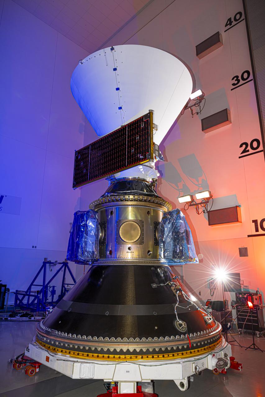 Technicians and engineers encapsulate NASA’s SPHEREx (Spectro-Photometer for the History of the Universe, Epoch of Reionization and Ices Explorer) observatory and PUNCH (Polarimeter to Unify the Corona and Heliosphere) satellites within a protective payload fairing inside the Astrotech Space Operations facility at Vandenberg Space Force Base in California, on Saturday, March 1, 2025. SPHEREx will use its telescope to provide an all-sky spectral survey, creating a 3D map of the entire sky to help scientists investigate the origins of our universe. PUNCH will study origins of the Sun’s outflow of material, or the solar wind, capturing continuous 3D images of the Sun’s corona and the solar wind’s journey into the solar system. Liftoff aboard a SpaceX Falcon 9 rocket is targeted for NET 10:09 EST (7:09 p.m. PST), Tuesday, March 4, 2025, at Space Launch Complex 4 East from Vandenberg Space Force Base in California.