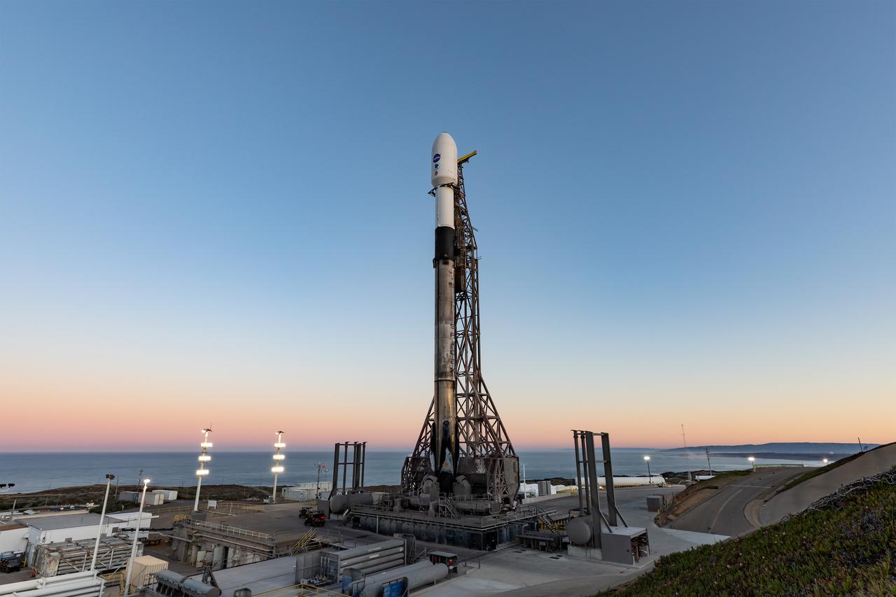 A SpaceX Falcon 9 rocket, carrying NASA’s SPHEREx (Spectro-Photometer for the History of the Universe, Epoch of Reionization and Ices Explorer) observatory and PUNCH (Polarimeter to Unify the Corona and Heliosphere) satellites, is vertical at Space Launch Complex 4 East from Vandenberg Space Force Base in California on Saturday March 8, 2025. SPHEREx will use its telescope to provide an all-sky spectral survey, creating a 3D map of the entire sky to help scientists investigate the origins of our universe. PUNCH will study origins of the Sun’s outflow of material, or the solar wind, capturing continuous 3D images of the Sun’s corona and the solar wind’s journey into the solar system. 