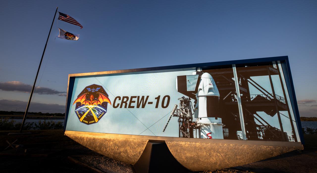 A graphic for NASA’s SpaceX Crew-10 mission is displayed on the historic countdown clock at the NASA News Center at the agency’s Kennedy Space Center in Florida on Monday, March 10, 2025. Crew-10 is the 10th crew rotation mission with SpaceX to the International Space Station as part of the agency’s Commercial Crew Program, sending NASA astronauts Anne McClain and Nichole Ayers, along with JAXA (Japan Aerospace Exploration Agency) astronaut Takuya Onishi and Roscosmos cosmonaut Kirill Peskov to the International Space Station aboard SpaceX’s Dragon spacecraft and Falcon 9 rocket. Launch is targeted for 7:48 p.m. EDT on Wednesday, March 12, 2025.