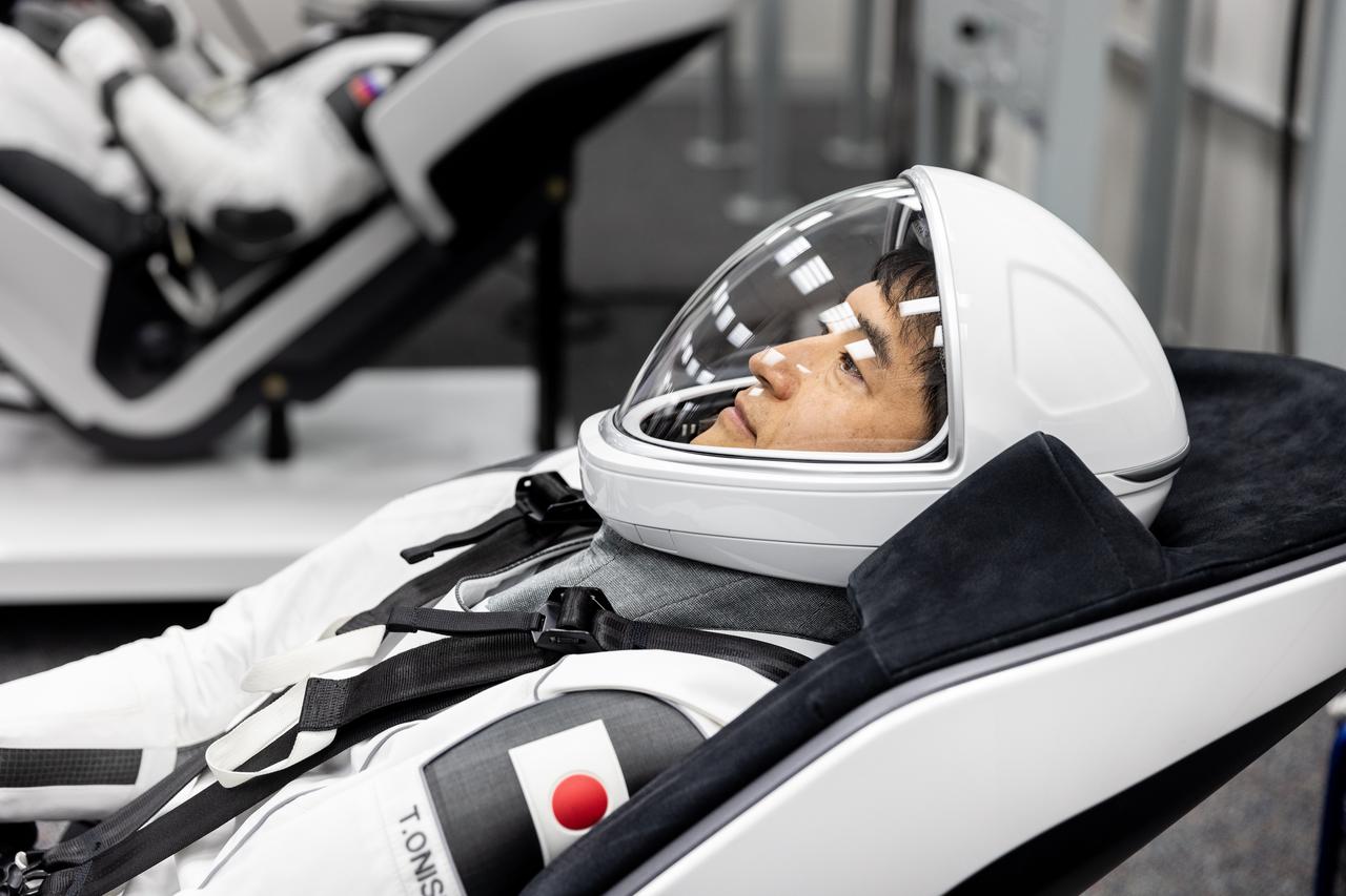 JAXA (Japan Aerospace Exploration Agency) astronaut Takuya Onishi is photographed in his SpaceX spacesuit inside the crew suit-up room in the Neil A. Armstrong Operations and Checkout Building at the agency’s Kennedy Space Center in Florida ahead of launch of NASA’s SpaceX Crew-10 mission on Wednesday, March 12, 2025. Onishi, NASA astronauts Anne McClain and Nichole Ayers, along with Roscosmos cosmonaut Kirill Peskov are scheduled to lift off aboard SpaceX’s Dragon spacecraft and Falcon 9 rocket at 7:48 p.m. EDT, from Launch Complex 39A at NASA Kennedy. Crew-10 is the 10th crew rotation mission with SpaceX to the space station as part of the agency’s Commercial Crew Program.