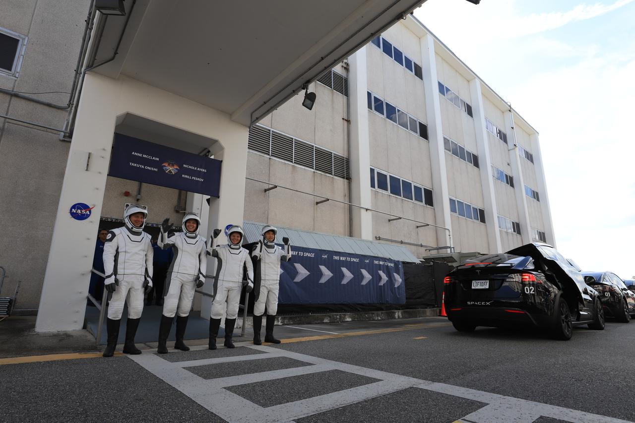 NASA’s SpaceX Crew-10 crew members pose for a photo after walking out of the Neil A. Armstrong Operations and Checkout Building at the agency’s Kennedy Space Center in Florida ahead of launch of the Crew-10 mission on Friday, March 14, 2025. From left to right, Roscosmos cosmonaut Kirill Peskov, NASA astronauts Anne McClain and Nichole Ayers, along with JAXA (Japan Aerospace Exploration Agency) astronaut Takuya Onishi are scheduled to lift off aboard SpaceX’s Dragon spacecraft and Falcon 9 rocket at 7:03 p.m. EDT, from Launch Complex 39A at NASA Kennedy. Crew-10 is the 10th crew rotation mission with SpaceX to the space station as part of the agency’s Commercial Crew Program.