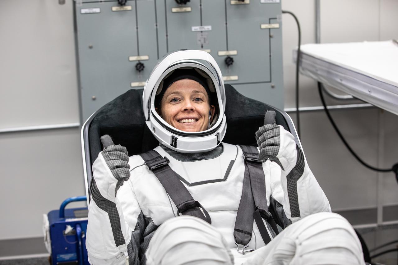 NASA astronaut Nichole Ayers is photographed in her SpaceX spacesuit inside the crew suit-up room in the Neil A. Armstrong Operations and Checkout Building at the agency’s Kennedy Space Center in Florida ahead of launch of NASA’s SpaceX Crew-10 mission on Friday, March 14, 2025. Ayers and fellow NASA astronaut Anne McClain, along with JAXA (Japan Aerospace Exploration Agency) astronaut Takuya Onishi and Roscosmos cosmonaut Kirill Peskov are scheduled to lift off aboard SpaceX’s Dragon spacecraft and Falcon 9 rocket at 7:03 p.m. EDT, from Launch Complex 39A at NASA Kennedy. Crew-10 is the 10th crew rotation mission with SpaceX to the space station as part of the agency’s Commercial Crew Program.