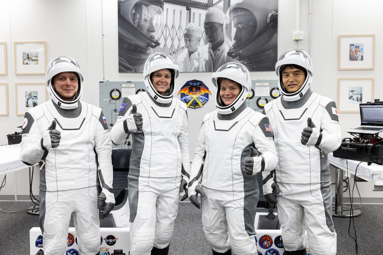NASA’s SpaceX Crew-10 crew members pose for a photograph inside the crew suit-up room in the Neil A. Armstrong Operations and Checkout Building at the agency’s Kennedy Space Center in Florida ahead of launch to the International Space Station on Friday, March 14, 2025. From left to right, Roscosmos cosmonaut Kirill Peskov, NASA astronauts Nichole Ayers and Anne McClain, as well as JAXA (Japan Aerospace Exploration Agency) astronaut Takuya Onishi are scheduled to lift off aboard SpaceX’s Dragon spacecraft and Falcon 9 rocket at 7:03 p.m. EDT, from Launch Complex 39A at NASA Kennedy. Crew-10 is the 10th crew rotation mission with SpaceX to the space station as part of the agency’s Commercial Crew Program