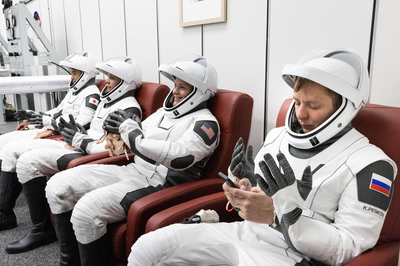 NASA’s SpaceX Crew-10 crew members are seated inside the crew suit-up room in the Neil A. Armstrong Operations and Checkout Building at the agency’s Kennedy Space Center in Florida ahead of launch to the International Space Station on Friday, March 14, 2025. From left to right, JAXA (Japan Aerospace Exploration Agency) astronaut Takuya Onishi, NASA astronauts Nichole Ayers and Anne McClain, along with Roscosmos cosmonaut Kirill Peskov are scheduled to lift off aboard SpaceX’s Dragon spacecraft and Falcon 9 rocket at 7:03 p.m. EDT, from Launch Complex 39A at NASA Kennedy. Crew-10 is the 10th crew rotation mission with SpaceX to the space station as part of the agency’s Commercial Crew Program.