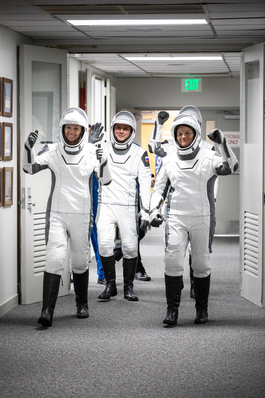 NASA’s SpaceX Crew-10 crew members walk out of the Neil A. Armstrong Operations and Checkout Building at the agency’s Kennedy Space Center in Florida ahead of launch on Friday, March 14, 2025. NASA astronauts Nichole Ayers (front, left) and Anne McClain (front, right), along with JAXA (Japan Aerospace Exploration Agency) astronaut Takuya Onishi (second row, right) and Roscosmos cosmonaut Kirill Peskov (second row, left) are scheduled to lift off aboard SpaceX’s Dragon spacecraft and Falcon 9 rocket at 7:03 p.m. EDT, from Launch Complex 39A at NASA Kennedy. Crew-10 is the tenth crew rotation mission with SpaceX to the space station as part of the agency’s Commercial Crew Program.