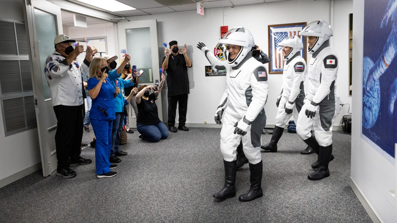 NASA’s SpaceX Crew-10 crew members walk out of the Astronaut Crew Quarters inside the Neil A. Armstrong Operations and Checkout Building at the agency’s Kennedy Space Center in Florida ahead of launch on Friday, March 14, 2025. NASA astronauts Nichole Ayers and Anne McClain, along with JAXA (Japan Aerospace Exploration Agency) astronaut Takuya Onishi and Roscosmos cosmonaut Kirill Peskov are scheduled to lift off aboard SpaceX’s Dragon spacecraft and Falcon 9 rocket at 7:03 p.m. EDT, from Launch Complex 39A at NASA Kennedy. Crew-10 is the tenth crew rotation mission with SpaceX to the space station as part of the agency’s Commercial Crew Program.