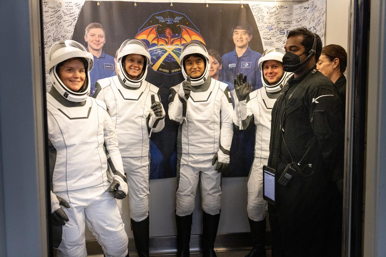 NASA’s SpaceX Crew-10 crew members enter an elevator as they prepare to walk out of the Neil A. Armstrong Operations and Checkout Building at the agency’s Kennedy Space Center in Florida ahead of launch on Friday, March 14, 2025. From left to right, NASA astronauts Anne McClain and Nichole Ayers, along with JAXA (Japan Aerospace Exploration Agency) astronaut Takuya Onishi and Roscosmos cosmonaut Kirill Peskov are scheduled to lift off aboard SpaceX’s Dragon spacecraft and Falcon 9 rocket at 7:03 p.m. EDT, from Launch Complex 39A at NASA Kennedy. Crew-10 is the tenth crew rotation mission with SpaceX to the space station as part of the agency’s Commercial Crew Program.