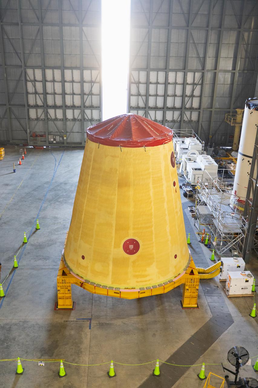 NASA’s Artemis II hardware, the launch vehicle stage adapter, is inside High Bay 4 on Thursday, March 20, 2025, at the Vehicle Assembly Building at NASA’s Kennedy Space Center in Florida ahead of rocket stacking operations. The cone shaped launch vehicle stage adapter connects the SLS (Space Launch System) Moon rocket to the upper stage, the interim cryogenic propulsion stage, and protects the rocket’s flight computers, avionics, and electrical devices during launch and ascent during the Artemis missions.