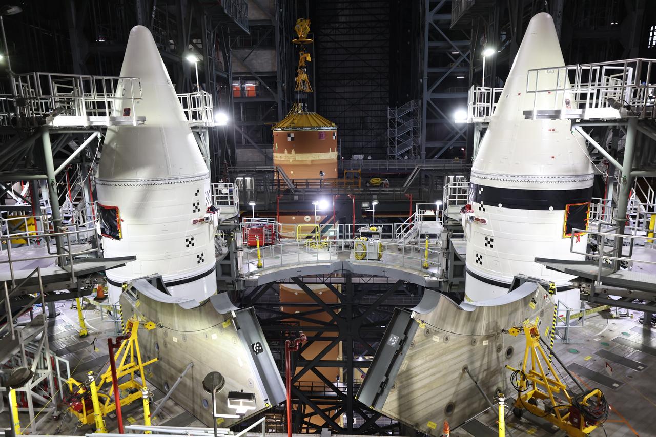Teams with NASA’s Exploration Ground Systems and primary contractor Amentum, integrate the SLS (Space Launch System) Moon rocket with the solid rocket boosters onto mobile launcher 1 inside High Bay 3 of the Vehicle Assembly Building at NASA’s Kennedy Space Center on Sunday, March 23, 2025. Artemis II is the first crewed test flight under NASA’s Artemis campaign and is another step toward missions on the lunar surface and helping the agency prepare for future human missions to Mars. 