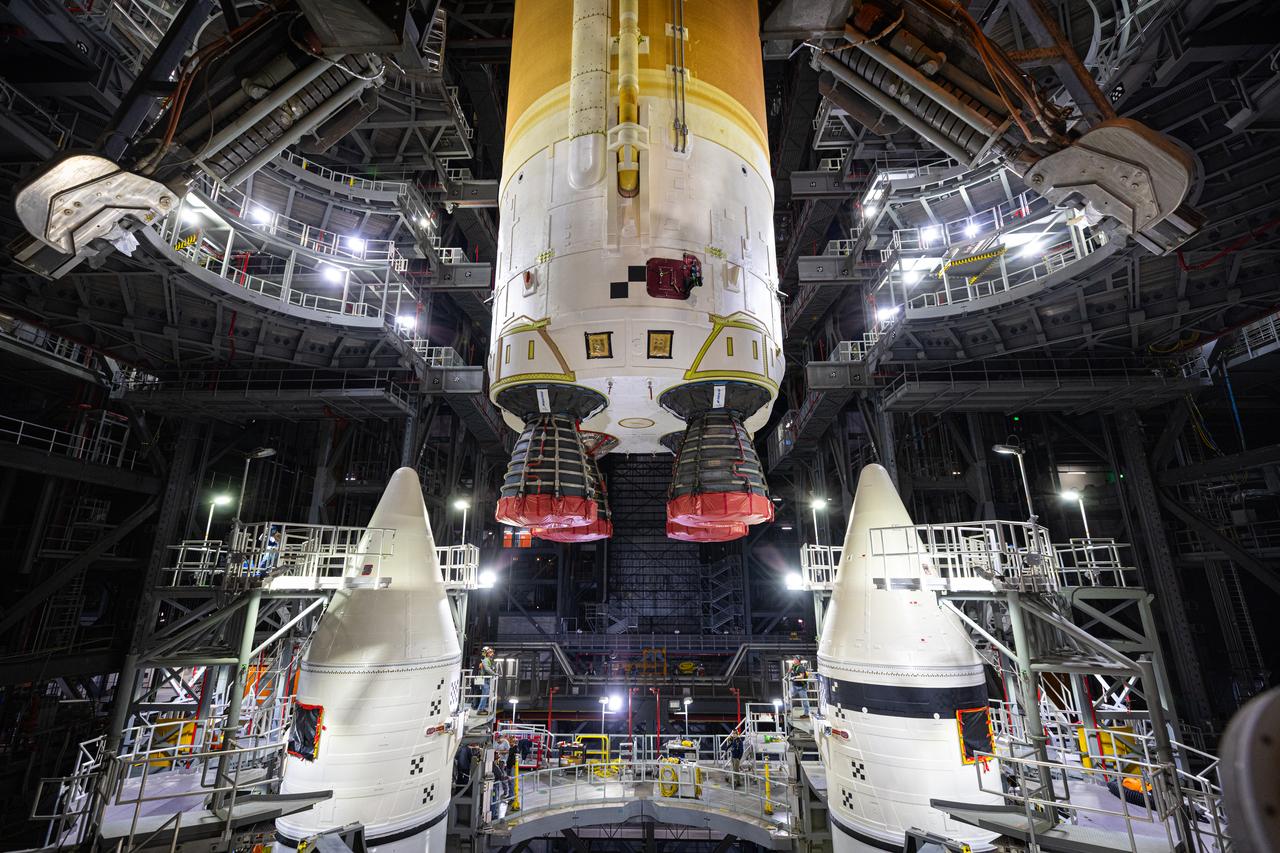 Teams with NASA’s Exploration Ground Systems and primary contractor Amentum, integrate the SLS (Space Launch System) Moon rocket with the solid rocket boosters onto mobile launcher 1 inside High Bay 3 of the Vehicle Assembly Building at NASA’s Kennedy Space Center on Sunday, March 23, 2025. Artemis II is the first crewed test flight under NASA’s Artemis campaign and is another step toward missions on the lunar surface and helping the agency prepare for future human missions to Mars.