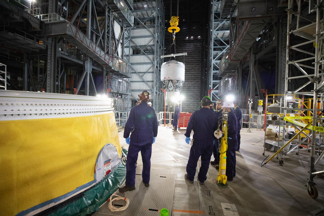 Teams with NASA’s Exploration Ground Systems Program begin integrating the interim cryogenic propulsion stage to the SLS (Space Launch System) launch vehicle stage adapter on Wednesday, April 30, 2025, inside the Vehicle Assembly Building at NASA’s Kennedy Space Center in Florida. The four-story propulsion system, built by Boeing and ULA (United Launch Alliance), is powered by an RL10 engine that will enable the Orion spacecraft to build up enough speed for the push toward the Moon during the Artemis II crewed test flight.