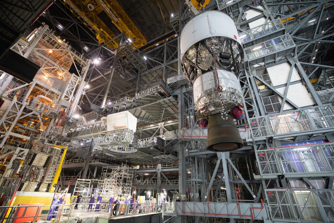 Teams with NASA’s Exploration Ground Systems Program begin integrating the interim cryogenic propulsion stage to the SLS (Space Launch System) launch vehicle stage adapter on Wednesday, April 30, 2025, inside the Vehicle Assembly Building at NASA’s Kennedy Space Center in Florida. The four-story propulsion system, built by Boeing and ULA (United Launch Alliance), is powered by an RL10 engine that will enable the Orion spacecraft to build up enough speed for the push toward the Moon during the Artemis II crewed test flight.
