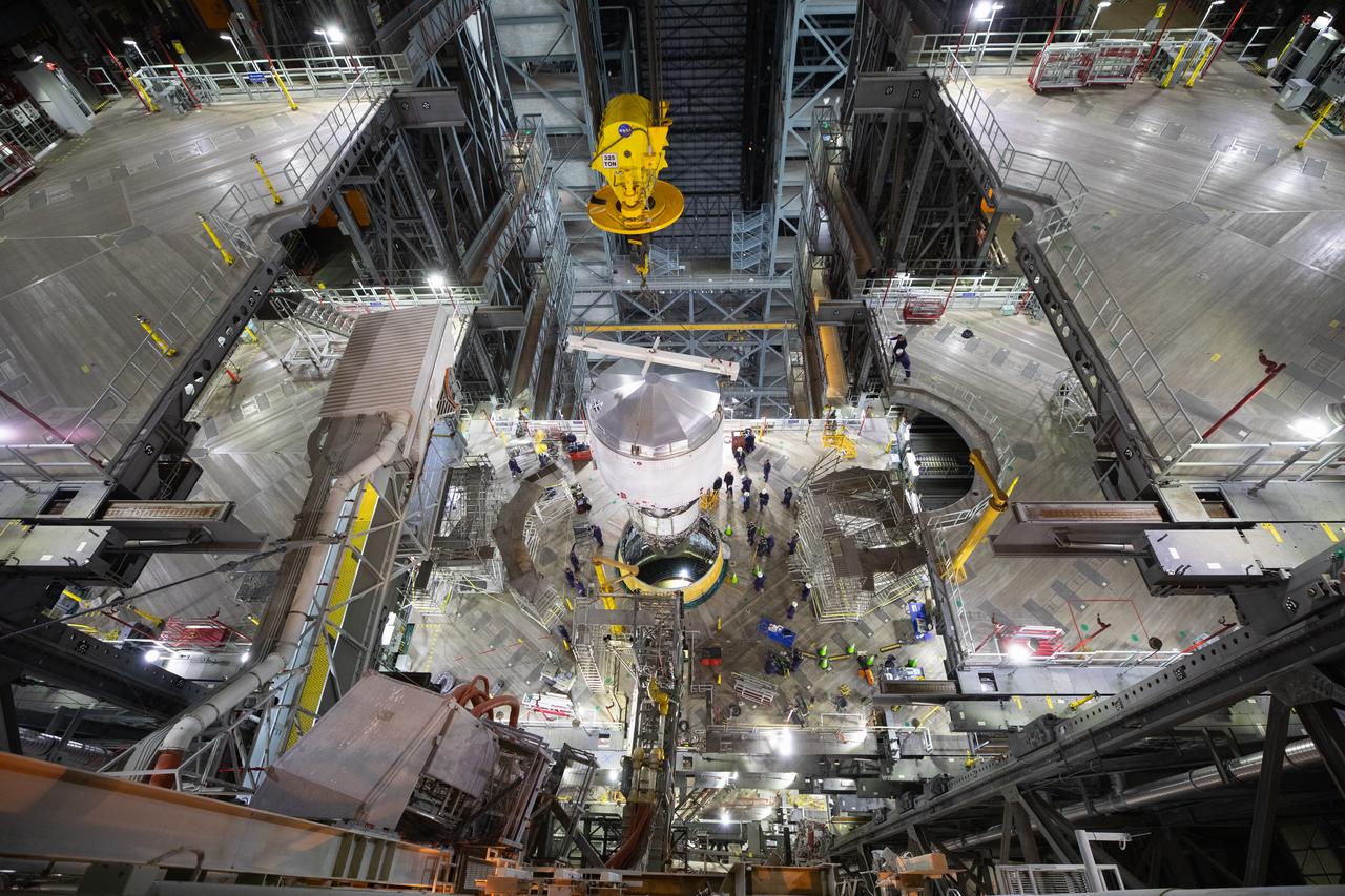 Teams with NASA’s Exploration Ground Systems Program begin integrating the interim cryogenic propulsion stage to the SLS (Space Launch System) launch vehicle stage adapter on Wednesday, April 30, 2025, inside the Vehicle Assembly Building at NASA’s Kennedy Space Center in Florida. The four-story propulsion system, built by Boeing and ULA (United Launch Alliance), is powered by an RL10 engine that will enable the Orion spacecraft to build up enough speed for the push toward the Moon during the Artemis II crewed test flight.