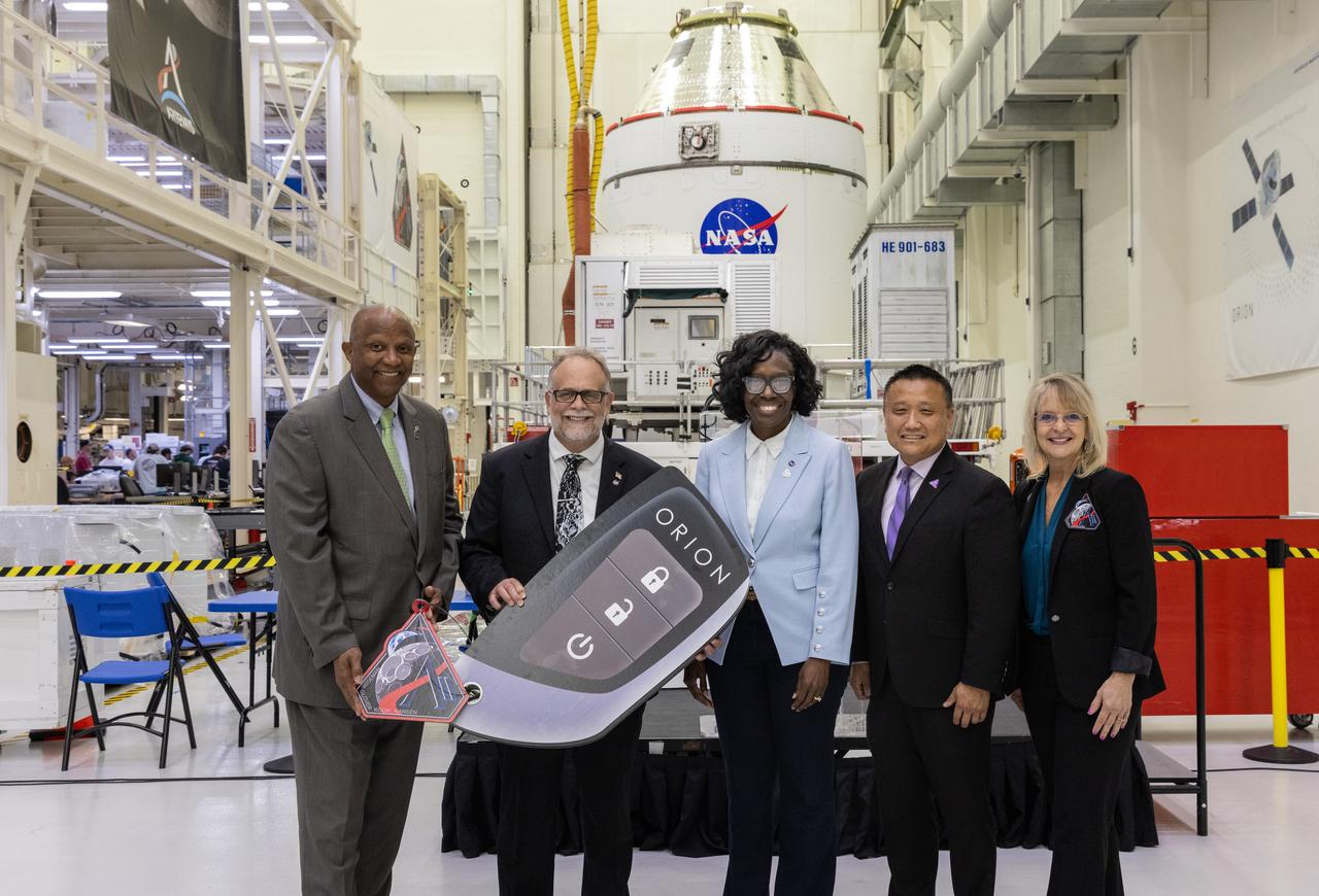 From left, Kelvin Manning, acting center director, NASA’s Kennedy Space Center; Shawn Quinn, Exploration Ground Systems program manager; Lakiesha Hawkins, assistant deputy associate administrator, Moon to Mars Program office; Howard Hu, Orion program manager; Debbie Korth, Orion deputy program manager, participate in a handover ceremony of NASA’s Artemis II Orion spacecraft to crews with the agency’s Exploration Ground Systems Program at the Neil A. Armstrong Operations and Checkout Building at NASA’s Kennedy Space Center in Florida on Thursday, May 1, 2025. The spacecraft will be transported to the Multi-Payload Processing Facility to undergo fueling and processing for prelaunch operations. The Artemis II test flight is the first crewed flight under NASA’s Artemis campaign and is another step toward missions on the lunar surface and helping the agency prepare for future human missions to Mars. 