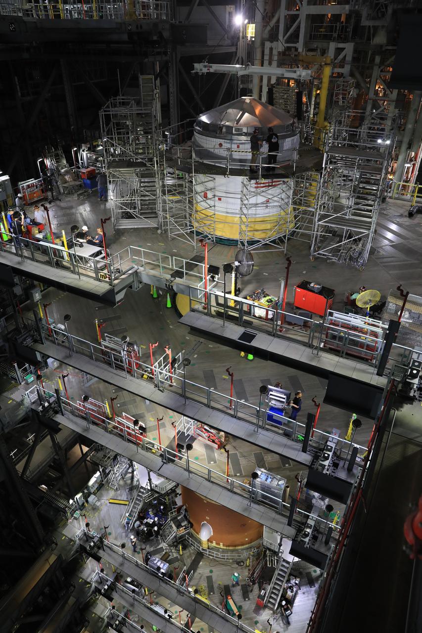 Teams with NASA’s Exploration Ground Systems Program finish integrating the interim cryogenic propulsion stage to the SLS (Space Launch System) launch vehicle stage adapter on Thursday, May 1, 2025, inside the Vehicle Assembly Building at NASA’s Kennedy Space Center in Florida. The four-story propulsion system, built by Boeing and ULA (United Launch Alliance), is powered by an RL10 engine that will enable the Orion spacecraft to build up enough speed for the push toward the Moon during the Artemis II crewed test flight.