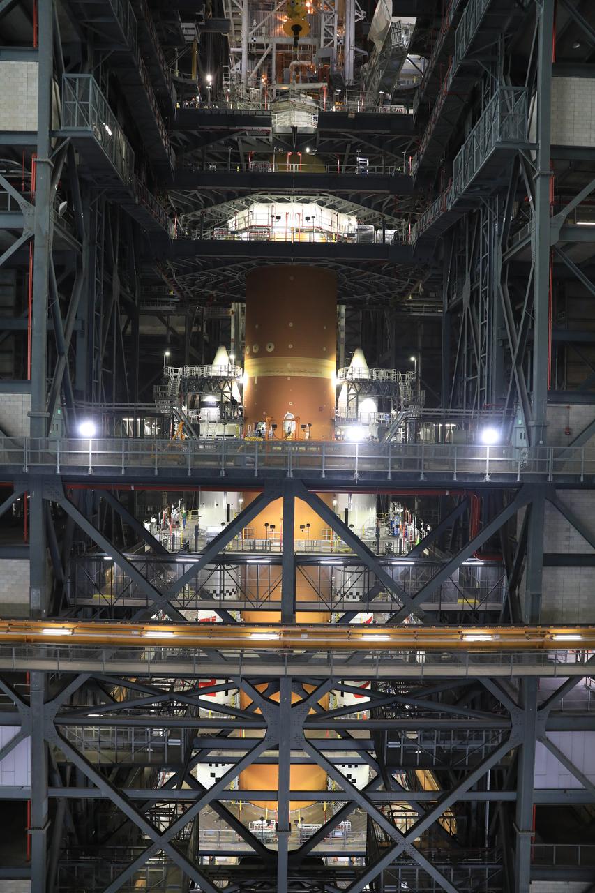 Teams with NASA’s Exploration Ground Systems Program finish integrating the interim cryogenic propulsion stage to the SLS (Space Launch System) launch vehicle stage adapter on Thursday, May 1, 2025, inside the Vehicle Assembly Building at NASA’s Kennedy Space Center in Florida. The four-story propulsion system, built by Boeing and ULA (United Launch Alliance), is powered by an RL10 engine that will enable the Orion spacecraft to build up enough speed for the push toward the Moon during the Artemis II crewed test flight.