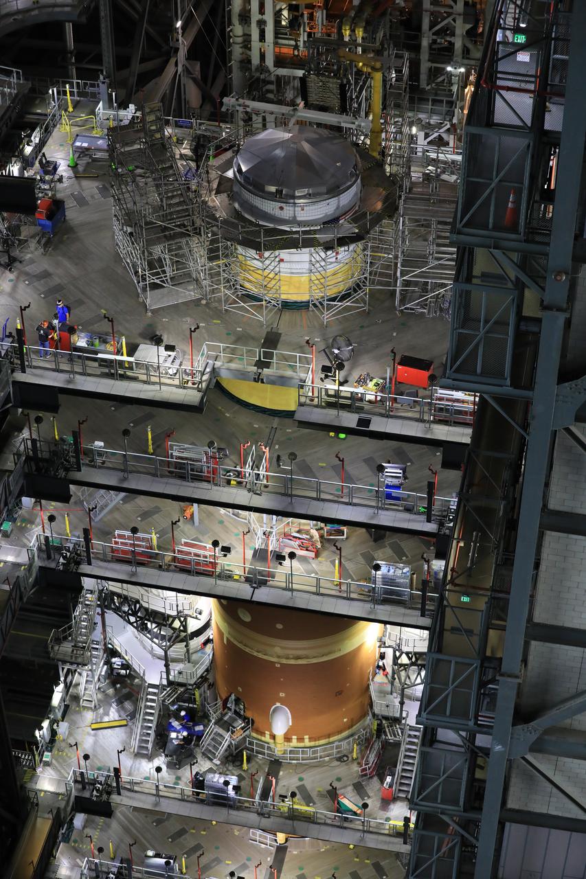 Teams with NASA’s Exploration Ground Systems Program finish integrating the interim cryogenic propulsion stage to the SLS (Space Launch System) launch vehicle stage adapter on Thursday, May 1, 2025, inside the Vehicle Assembly Building at NASA’s Kennedy Space Center in Florida. The four-story propulsion system, built by Boeing and ULA (United Launch Alliance), is powered by an RL10 engine that will enable the Orion spacecraft to build up enough speed for the push toward the Moon during the Artemis II crewed test flight.
