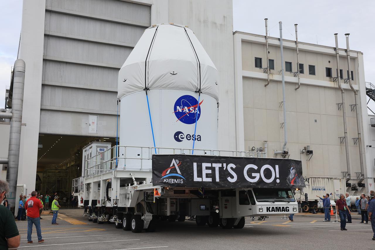 NASA’s KAMAG transporter carries the agency’s Artemis II Orion spacecraft from the Neil A. Armstrong Operations and Checkout Building to the Multi-Payload Processing Facility at Kennedy Space Center in Florida on Saturday, May 3, 2025. The Orion spacecraft will undergo fueling and processing operations at the Multi-Function Facility. The Artemis II test flight is the first crewed flight under NASA’s Artemis campaign and is another step toward missions on the lunar surface and helping the agency prepare for future human missions to Mars.