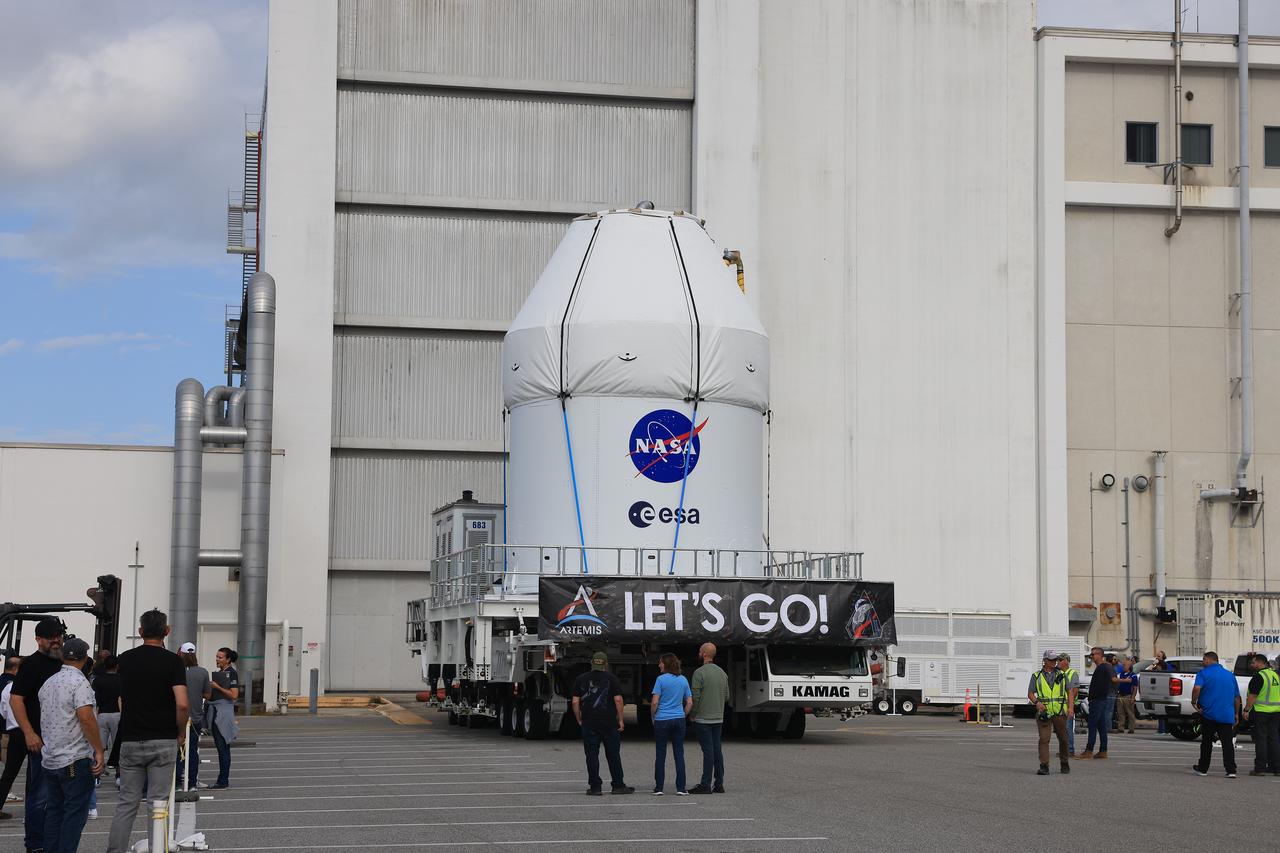 NASA’s KAMAG transporter carries the agency’s Artemis II Orion spacecraft from the Neil A. Armstrong Operations and Checkout Building to the Multi-Payload Processing Facility at Kennedy Space Center in Florida on Saturday, May 3, 2025. The Orion spacecraft will undergo fueling and processing operations at the Multi-Function Facility. The Artemis II test flight is the first crewed flight under NASA’s Artemis campaign and is another step toward missions on the lunar surface and helping the agency prepare for future human missions to Mars.
