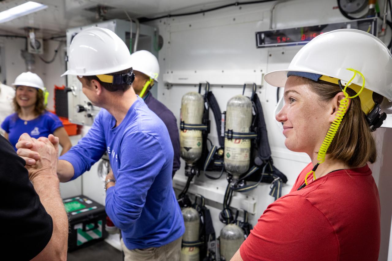 From left, NASA astronaut Christina Koch, Artemis II mission specialist; NASA astronaut Reid Wiseman, Artemis II commander; CSA (Canadian Space Agency) astronaut Jenni Gibbons, Artemis II backup crew member; and teams from the agency’s Exploration Ground Systems Program participate in emergency egress training inside the Vehicle Assembly Building at NASA’s Kennedy Space Center in Florida on Monday, May 5, 2025. Artemis II will take four astronauts around the Moon, the first crewed mission on NASA’s path to establishing a long-term presence for science and exploration through Artemis.