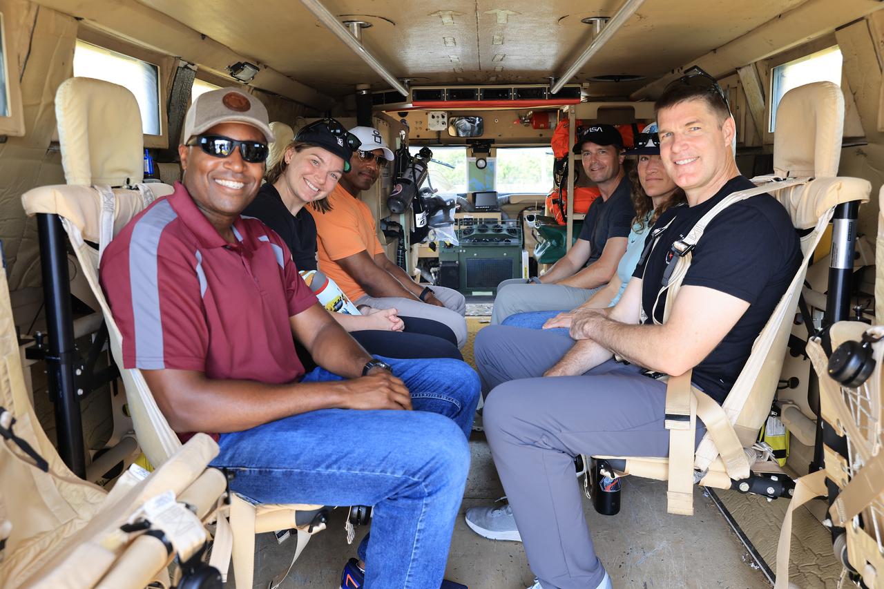 Crew members and backup members for NASA’s Artemis II mission and teams from the agency’s Exploration Ground Systems Program participate in emergency egress training at Launch Complex 39B at NASA’s Kennedy Space Center in Florida on Tuesday, May 6, 2025. From left, Andre Douglas, NASA’s Artemis II backup crew member; CSA (Canadian Space Agency) astronaut Jenni Gibbons, Artemis II backup crew member; NASA astronaut Victor Glover, Artemis II pilot; NASA astronaut Reid Wiseman, Artemis II commander; NASA astronaut Christina Koch, Artemis II mission specialist; and CSA astronaut Jeremy Hansen, Artemis II mission specialist sit in the back of a mine-resistant ambush protected vehicle, or MRAP. Originally designed for military applications, the 45,000-pound MRAP offers a mobile bunker for astronauts and ground crews in the unlikely event they must get away from the launch pad quickly in an emergency.