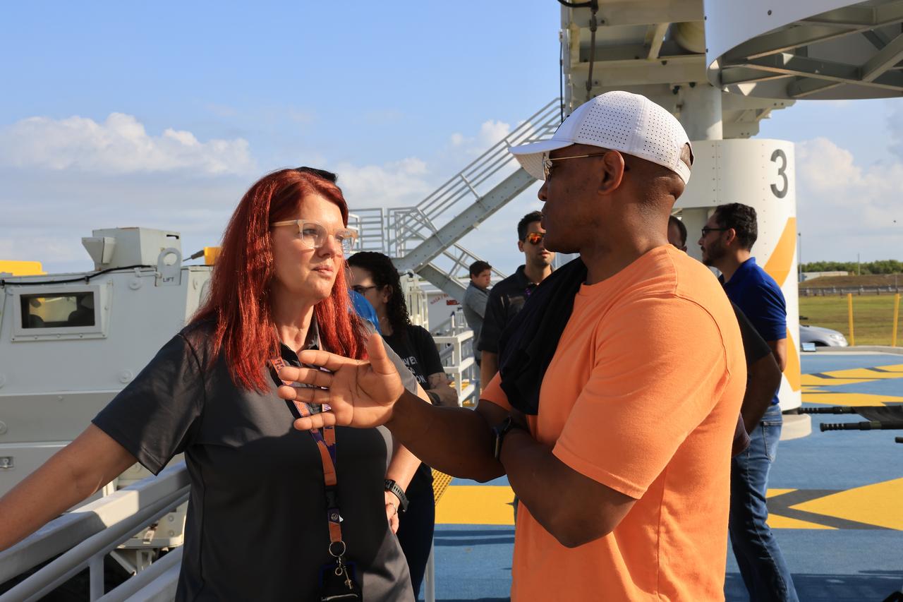 From left, Charlie Blackwell-Thompson, Artemis launch director with NASA’s Exploration Ground Systems Program, and Artemis II pilot Victor Glover participate in training at Launch Complex 39B at the agency’s Kennedy Space Center in Florida on Tuesday, May 6, 2025. Glover and fellow Artemis II crew members and backup members trained with the mine-resistant ambush protected vehicles, or MRAPs, inside the launch pad area. Originally designed for military applications, the 45,000-pound MRAP offers a mobile bunker for astronauts and ground crews in the unlikely event they must get away from the launch pad quickly in an emergency.