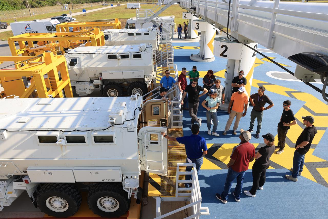 Crew members and backup members for NASA’s Artemis II mission and teams from the agency’s Exploration Ground Systems Program participate in emergency egress training at Launch Complex 39B at NASA’s Kennedy Space Center in Florida on Tuesday, May 6, 2025. Teams trained with the mine-resistant ambush protected vehicles, or MRAPs, inside the launch pad terminus area, where the emergency egress baskets carrying the astronauts and flight crew will arrive following their safe exit from the mobile launcher. Originally designed for military applications, the 45,000-pound MRAP offers a mobile bunker for astronauts and ground crews in the unlikely event they must get away from the launch pad quickly in an emergency.