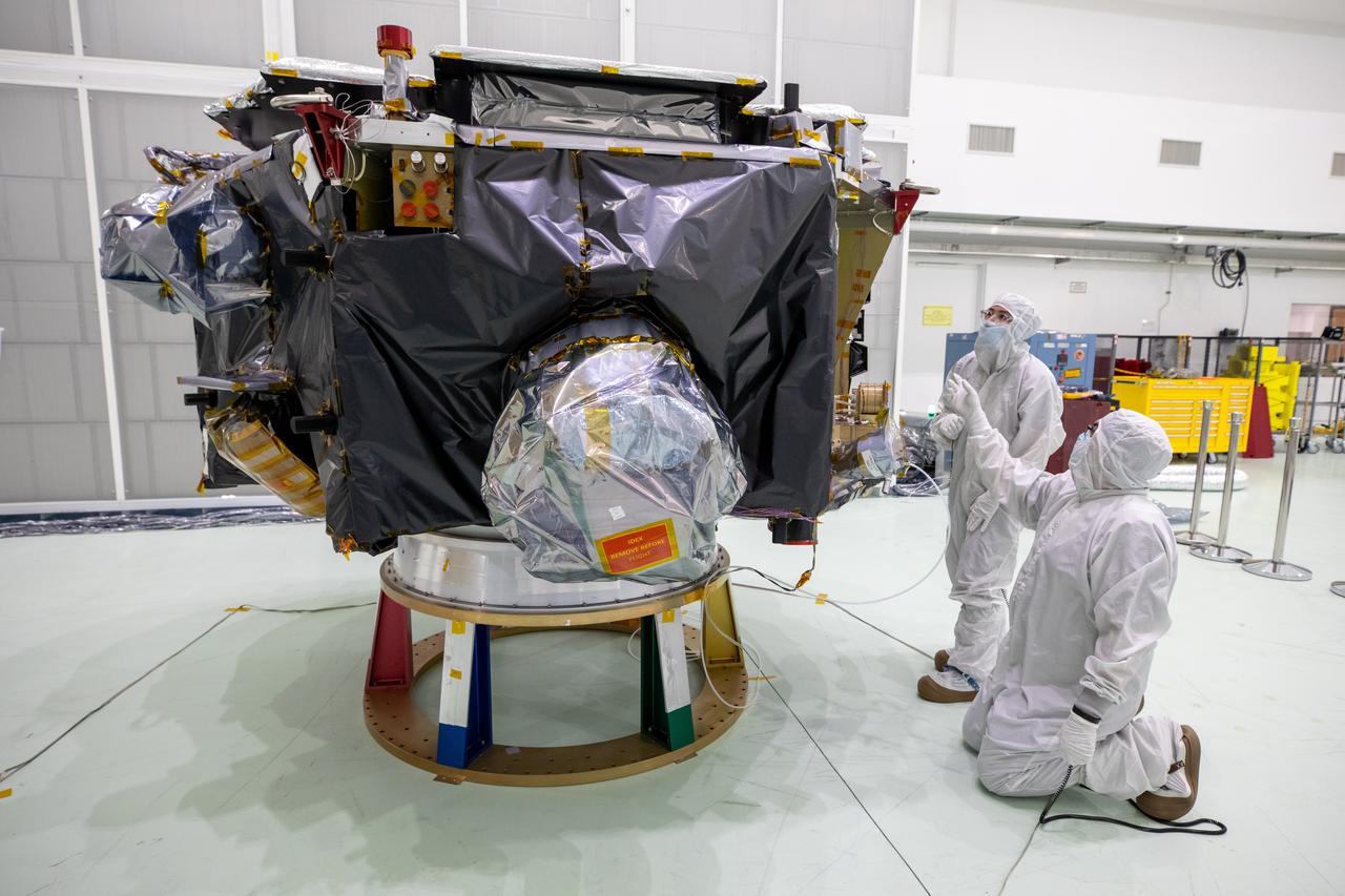 Technicians remove protective coverings form NASA’s IMAP (Interstellar Mapping and Acceleration Probe) inside the high bay at the Astrotech Space Operations Facility near the agency’s Kennedy Space Center in Florida on Thursday, May 29,2025. The observatory will study how the Sun shapes the boundaries of the heliosphere, the bubble protecting around our solar system, and is targeted for launch this fall aboard a SpaceX Falcon 9 rocket from Launch Complex 39A at NASA Kennedy. 