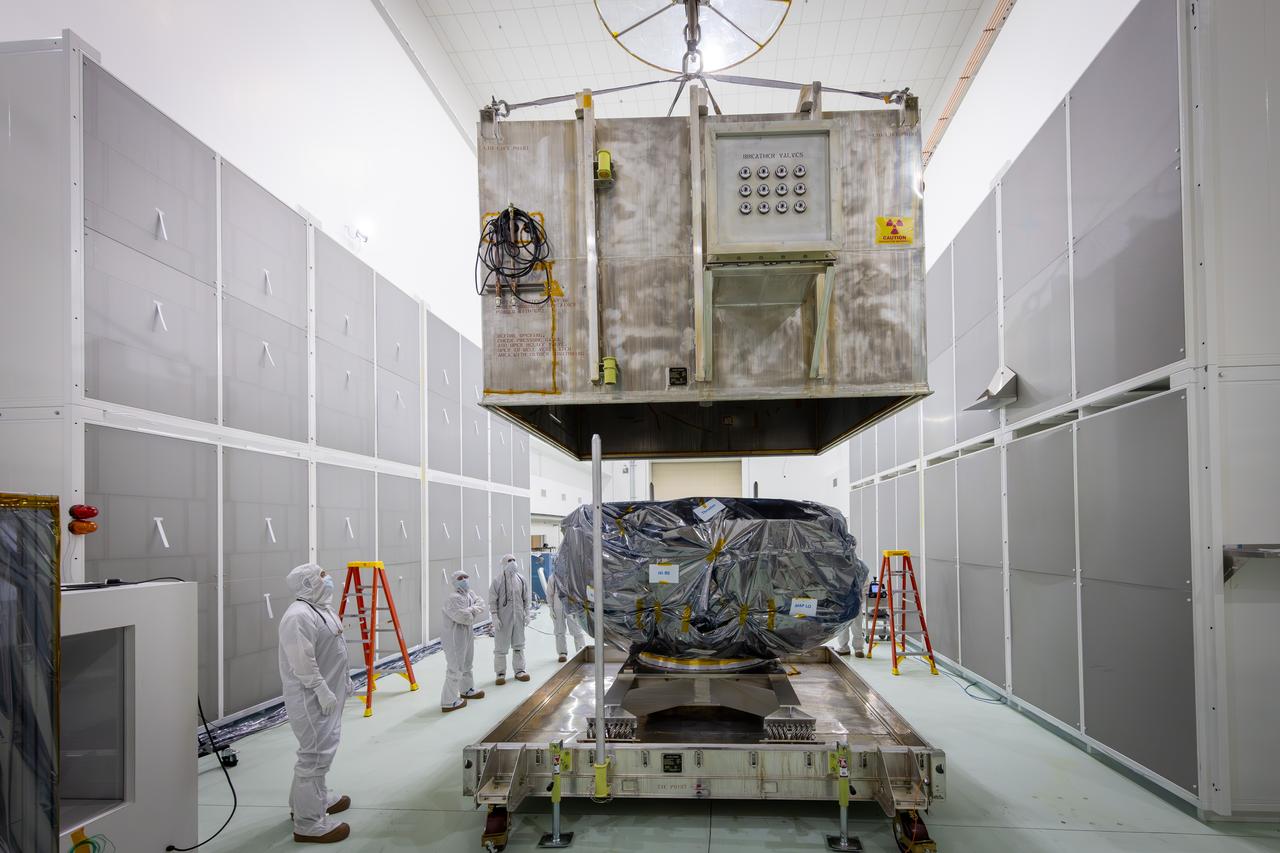 Technicians remove NASA’s IMAP (Interstellar Mapping and Acceleration Probe) spacecraft from its shipping container inside the high bay at the Astrotech Space Operations Facility near the agency’s Kennedy Space Center in Florida on Thursday, May 29, 2025. The observatory will study how the Sun shapes the boundaries of the heliosphere, the bubble protecting around our solar system, and is targeted for launch this fall aboard a SpaceX Falcon 9 rocket from Launch Complex 39A at NASA Kennedy. 