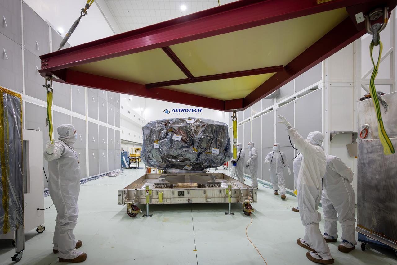 Technicians lift NASA’s IMAP (Interstellar Mapping and Acceleration Probe) spacecraft onto a work stand inside the high bay at the Astrotech Space Operations Facility near the agency’s Kennedy Space Center in Florida on Thursday, May 29, 2025. The observatory will study how the Sun shapes the boundaries of the heliosphere, the bubble protecting around our solar system, and is targeted for launch this fall aboard a SpaceX Falcon 9 rocket from Launch Complex 39A at NASA Kennedy. 