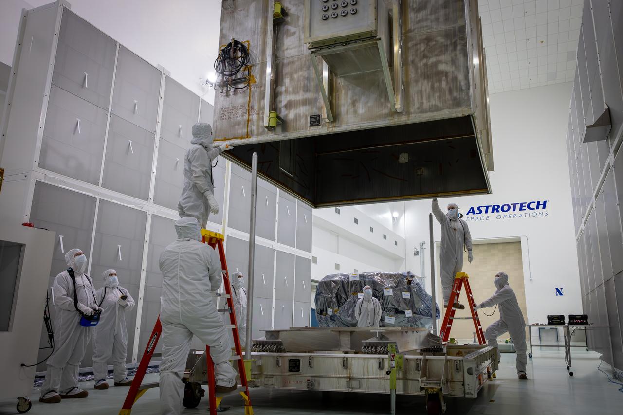 Technicians remove NASA’s IMAP (Interstellar Mapping and Acceleration Probe) spacecraft from its shipping container inside the high bay at the Astrotech Space Operations Facility near the agency’s Kennedy Space Center in Florida on Thursday, May 29, 2025. The observatory will study how the Sun shapes the boundaries of the heliosphere, the bubble protecting around our solar system, and is targeted for launch this fall aboard a SpaceX Falcon 9 rocket from Launch Complex 39A at NASA Kennedy. 