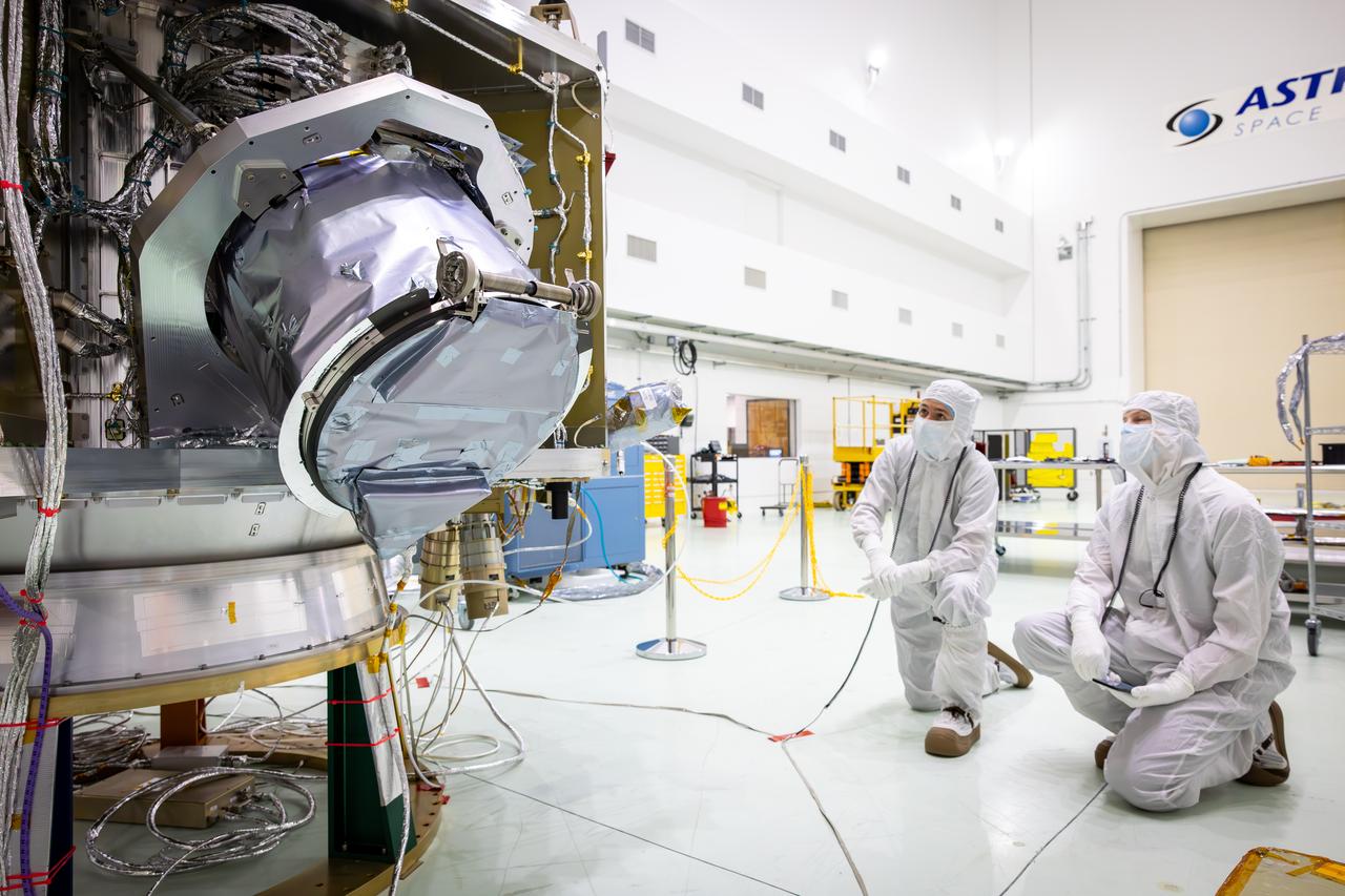 Technicians test the spring-activated door on the Interstellar Dust Experiment (IDEX) instrument of NASA’s IMAP (Interstellar Mapping and Acceleration Probe) observatory inside the high bay at the Astrotech Space Operations Facility near the agency’s Kennedy Space Center in Florida on Tuesday, June 3, 2025. The door will remain closed to protect IDEX from contamination during integration and launch. Once in space, the door will swing open permanently to allow interstellar and interplanetary dust to flow into the instrument for measurement. The IMAP observatory will study how the Sun shapes the boundaries of the heliosphere, the protective bubble around our solar system. Launch is targeted for no earlier than September 2025 aboard a SpaceX Falcon 9 rocket from Launch Complex 39A at NASA Kennedy.