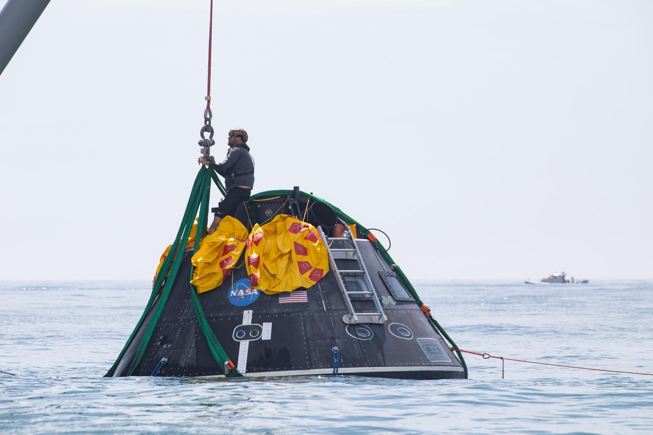 Teams with NASA and the Department of Defense (DoD) rehearse recovery procedures for a launch pad abort scenario off the coast of Florida near the agency’s Kennedy Space Center on Wednesday, June 11, 2025. Utilizing mannequin crew members inside the Crew Module Test Article (CMTA) – a full-scale mockup of the Orion spacecraft – the simulations practiced abort timelines and joint NASA and DoD recovery procedures supported by Artemis II launch and flight control teams, as NASA prepares to send four astronauts around the Moon and back next year as part of the agency’s first crewed Artemis mission.